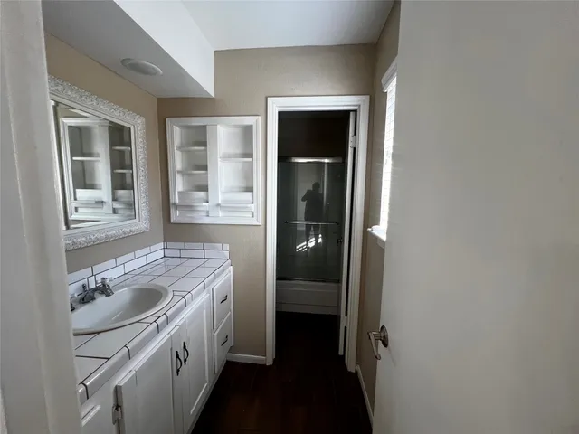 a bathroom with a sink a washer and dryer