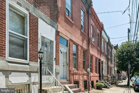 a view of a building with a street