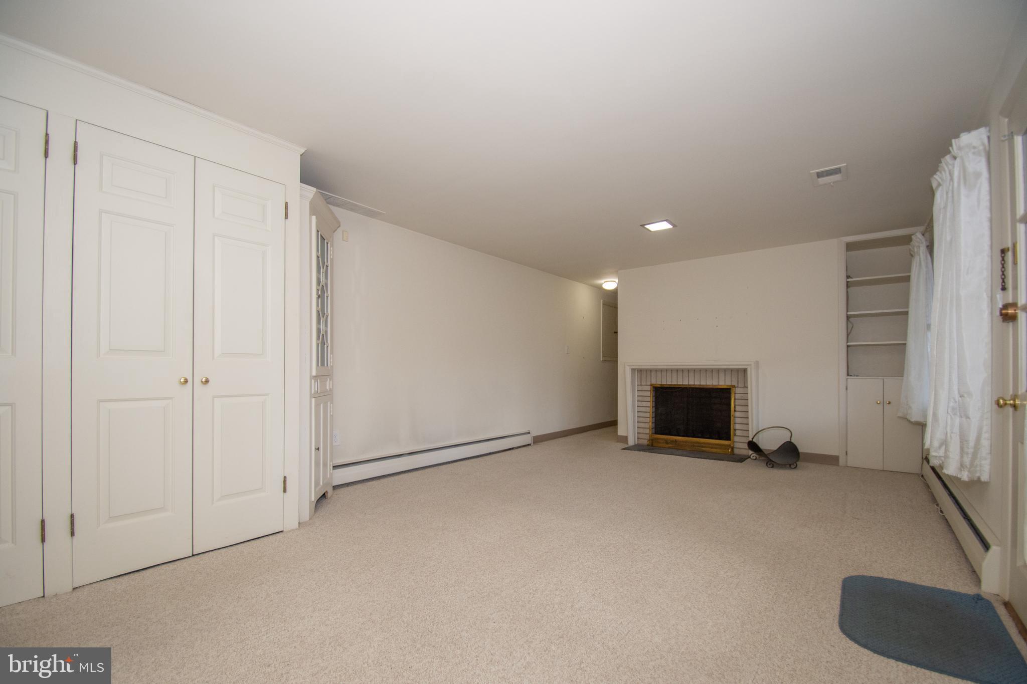 249 Orchard Road Paoli, PA 19301 - Photo 21 of 29 Finished Walk Out Basement with Fireplace