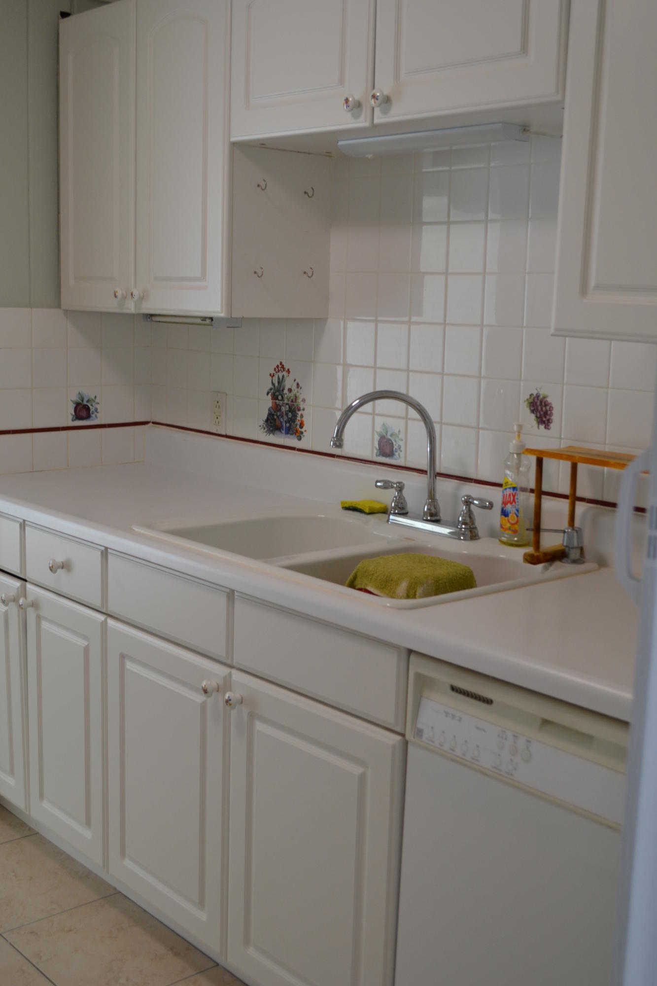 39 Bass Avenue Key Largo, FL 33037 - Photo 12 of 25 a kitchen with cabinets a sink and dishwasher