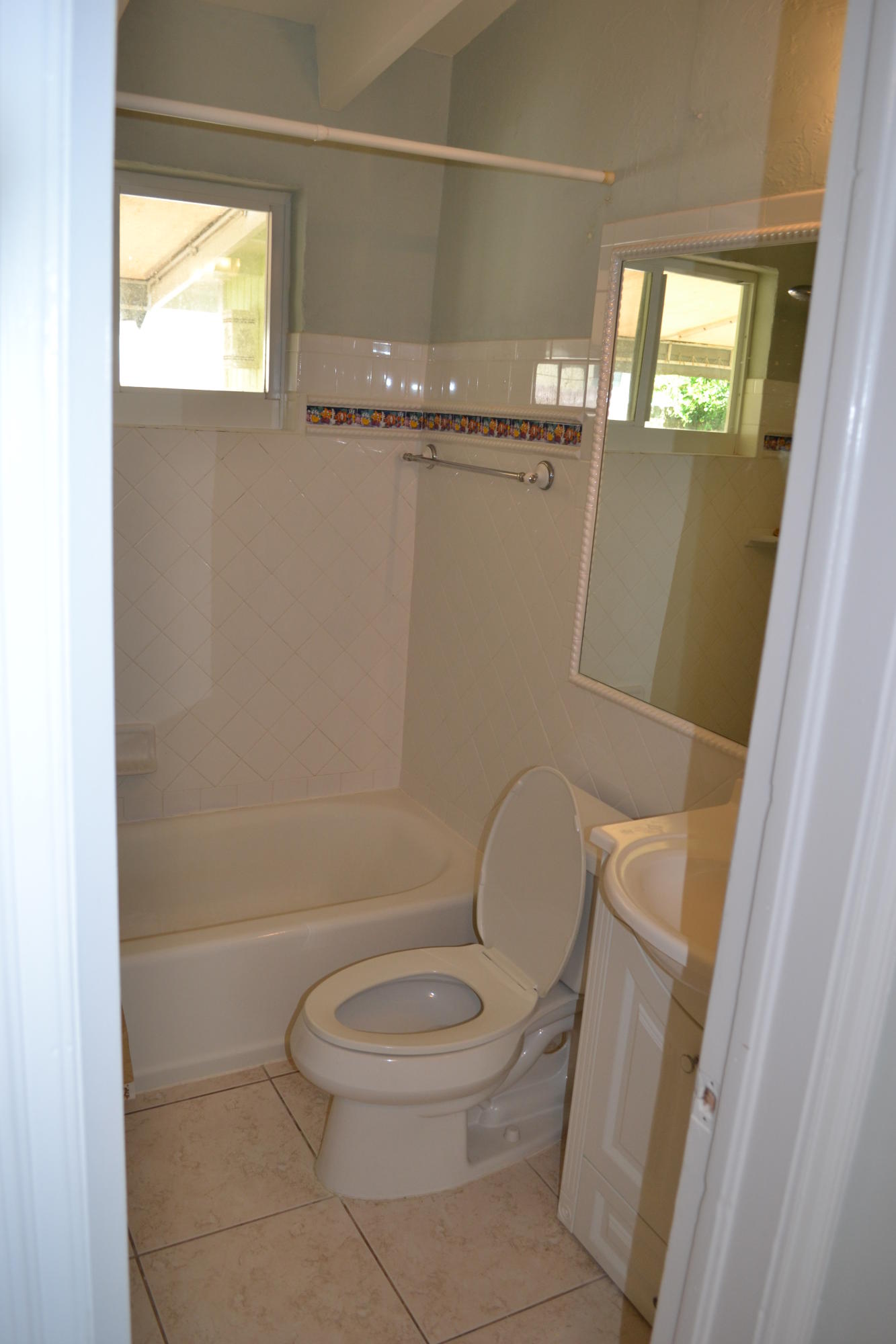 39 Bass Avenue Key Largo, FL 33037 - Photo 18 of 25 a bathroom with a toilet and a shower