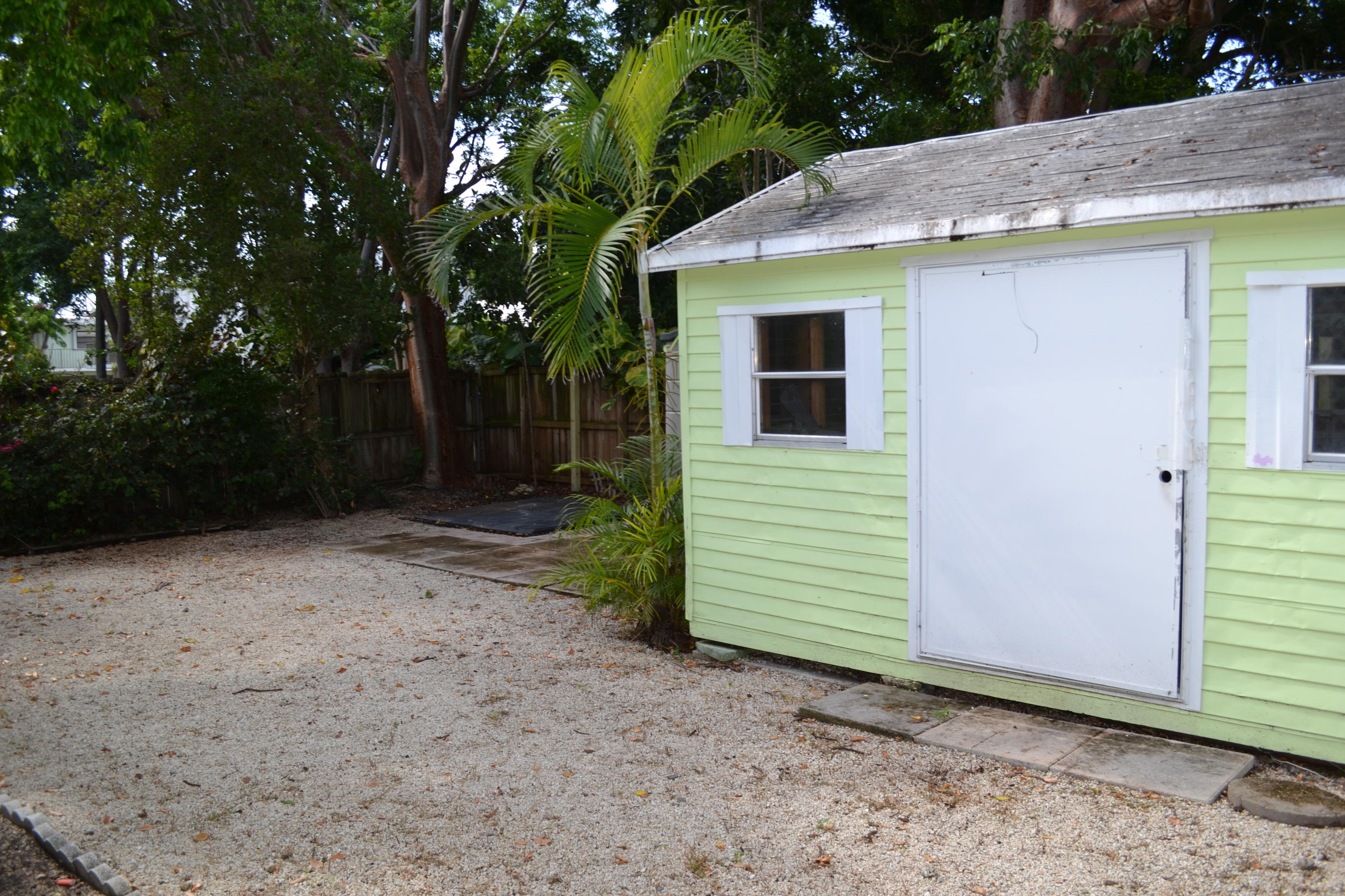 39 Bass Avenue Key Largo, FL 33037 - Photo 5 of 25 a view of a house with a backyard