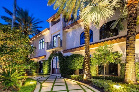 a view of swimming pool with outdoor seating and plants