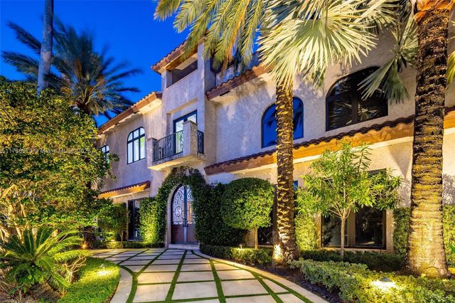 a view of swimming pool with outdoor seating and plants