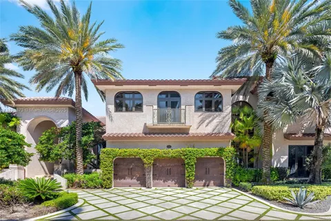 a view of a patio with table and chairs and potted plants