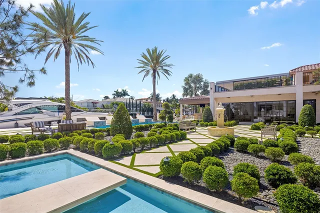 a patio with a table and chairs