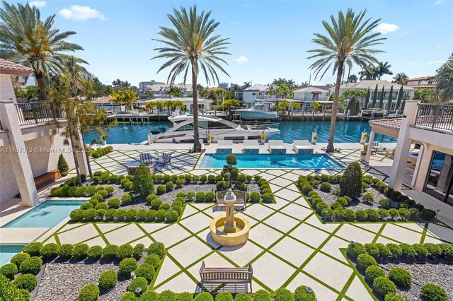 a living room with furniture gym equipment and a large window