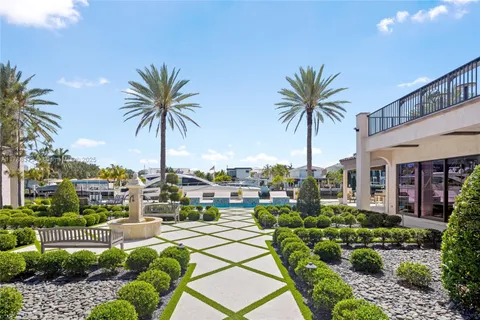 a living room with furniture gym equipment and view of kitchen