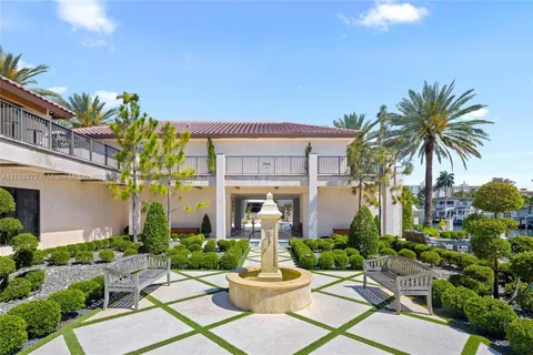 a front view of a house with fountain