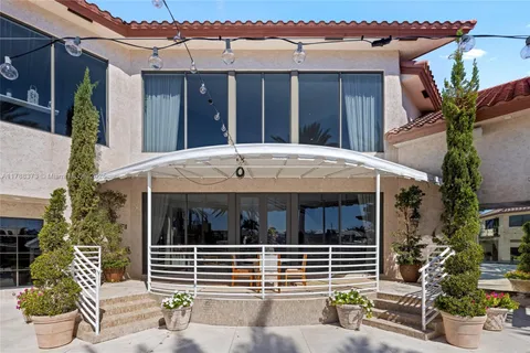 a view of a house with outdoor seating area