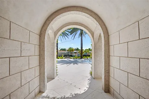 a view of a kitchen with a sink and a fireplace