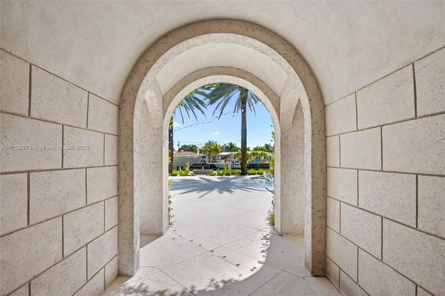 a view of a kitchen with a sink and a fireplace