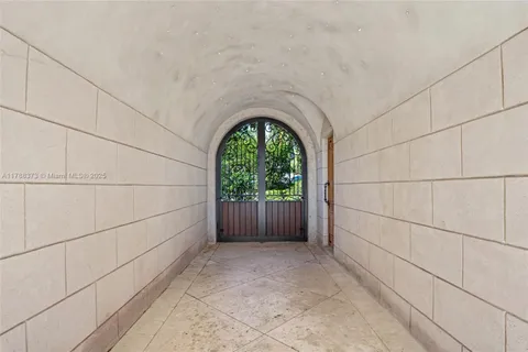 a front view of a house with swimming pool and seating space