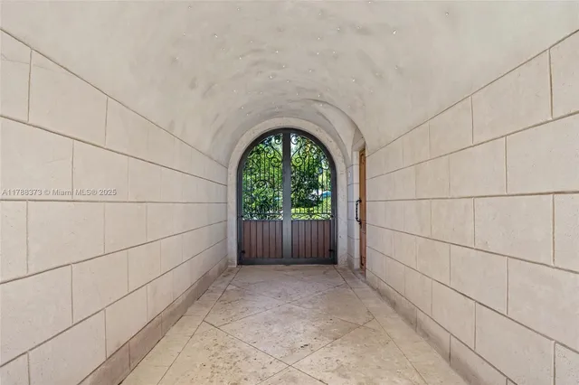 a front view of a house with swimming pool and seating space
