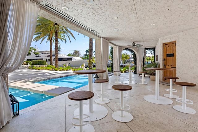 a view of a swimming pool with a lounge chair