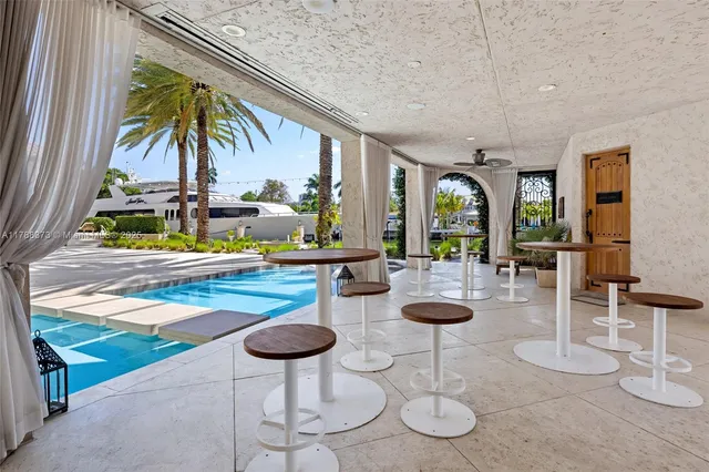 a view of a swimming pool with a lounge chair