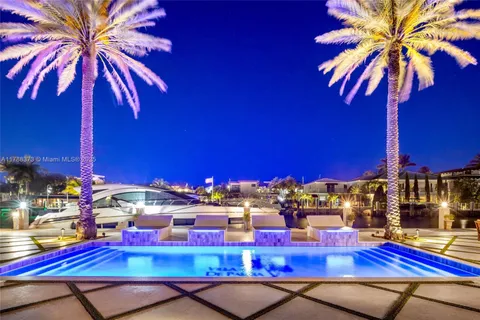 a view of a patio with dining table and chairs