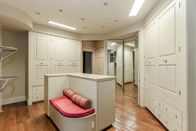 a view of a hallway with seating area