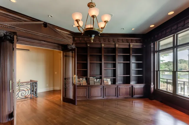 a view of a room with furniture and a chandelier