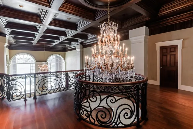 an aerial view of ocean and residential houses with outdoor space