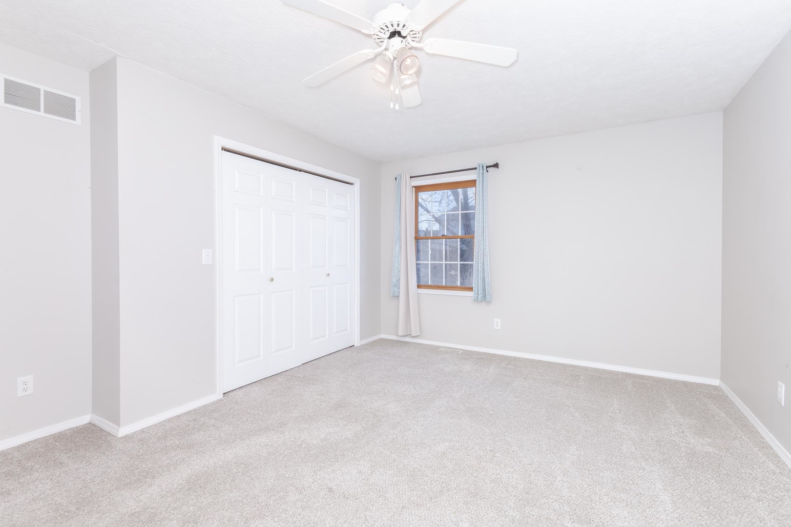 1321 Beacon Hill Court Normal, IL 61761 - Photo 16 of 45 an empty room with windows and fan