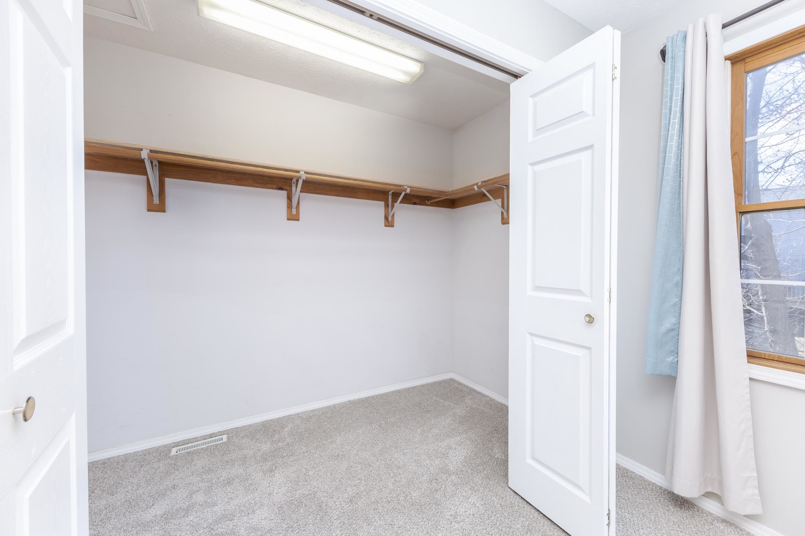 1321 Beacon Hill Court Normal, IL 61761 - Photo 18 of 45 a view of a room with rack on the wall