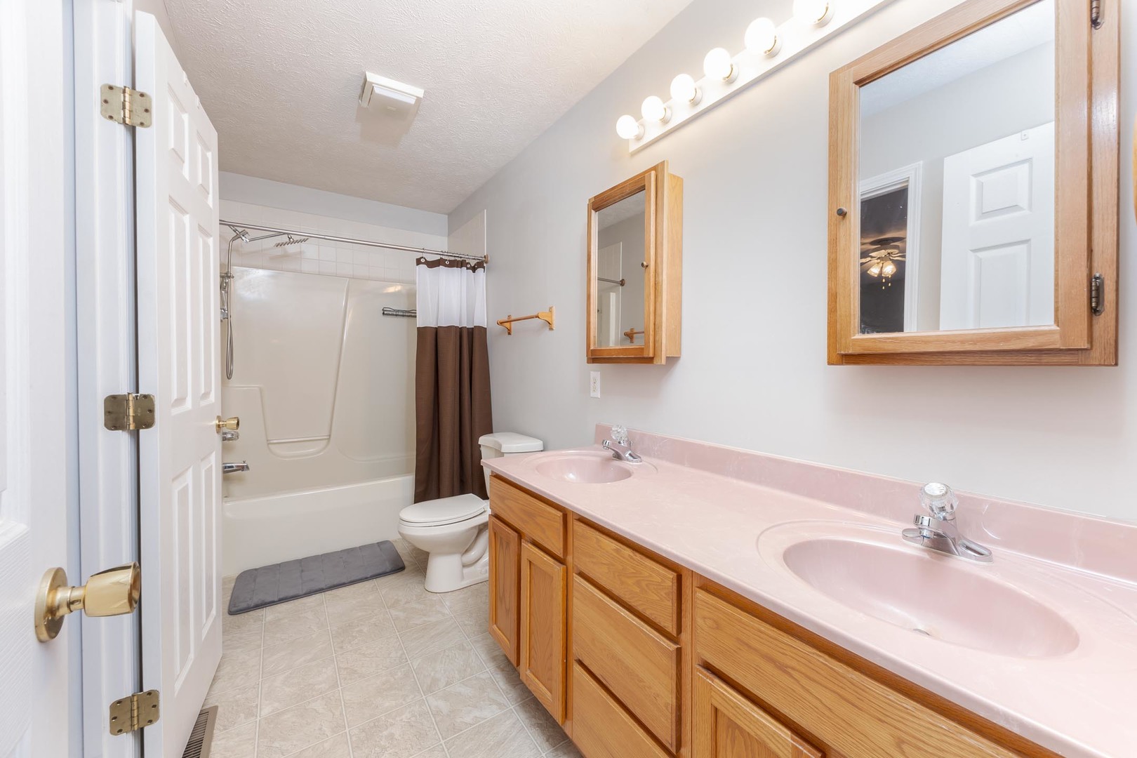 1321 Beacon Hill Court Normal, IL 61761 - Photo 20 of 45 a bathroom with a double vanity sink toilet mirror and bathtub