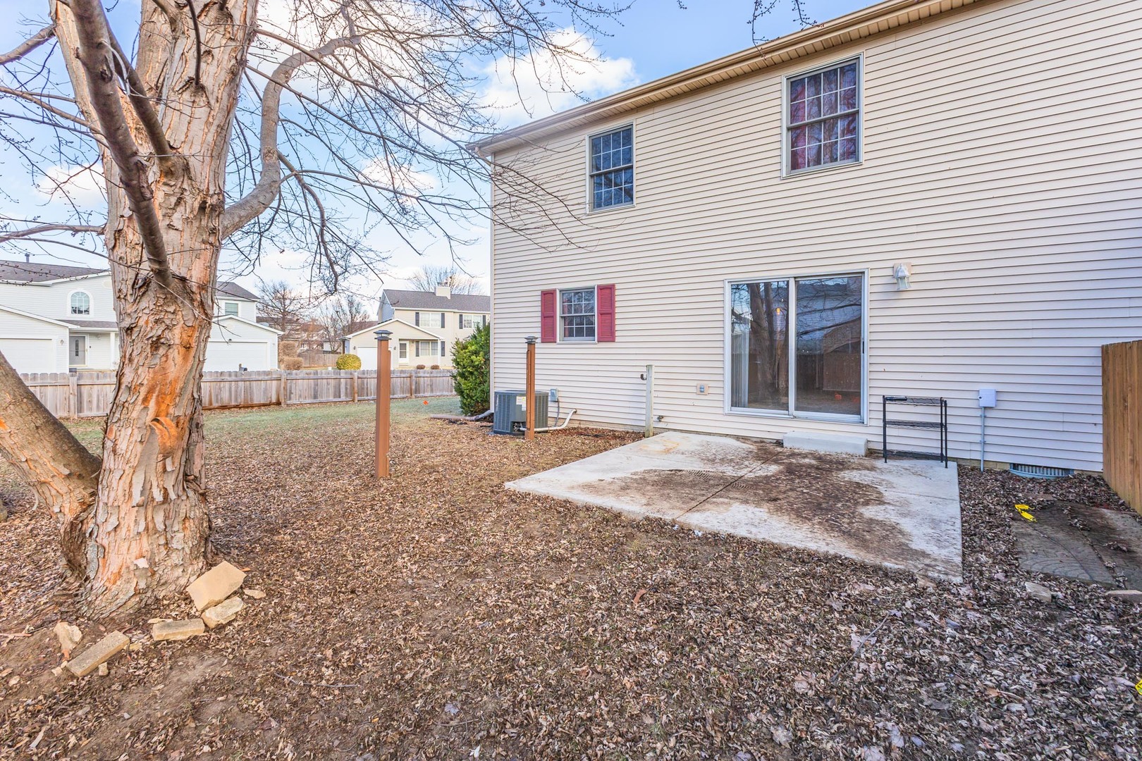 1321 Beacon Hill Court Normal, IL 61761 - Photo 30 of 45 a view of a backyard with large trees