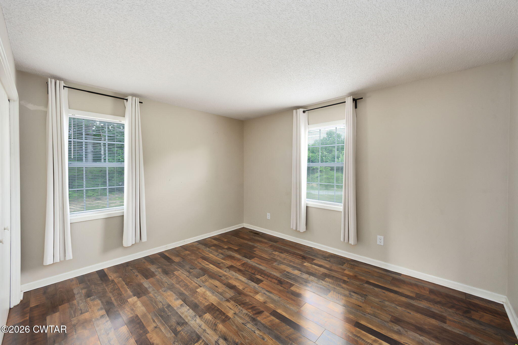306 Jim Jackson Road Humboldt, TN 38343 - Photo 21 of 29 a view of empty room with wooden floor and fan