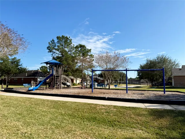 a view of a swimming pool with an outdoor seating