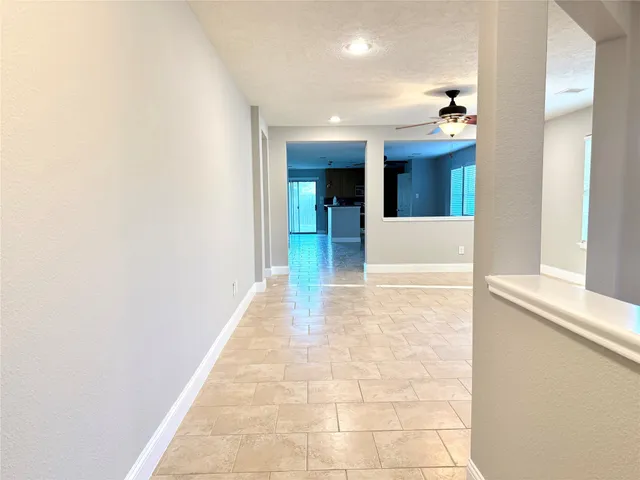 a view of hallway with seating space