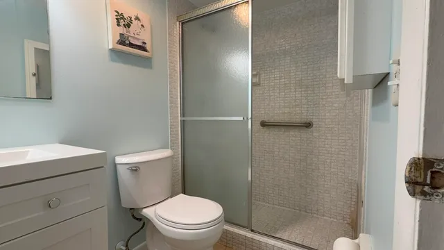 a view of a bathroom from a corridor