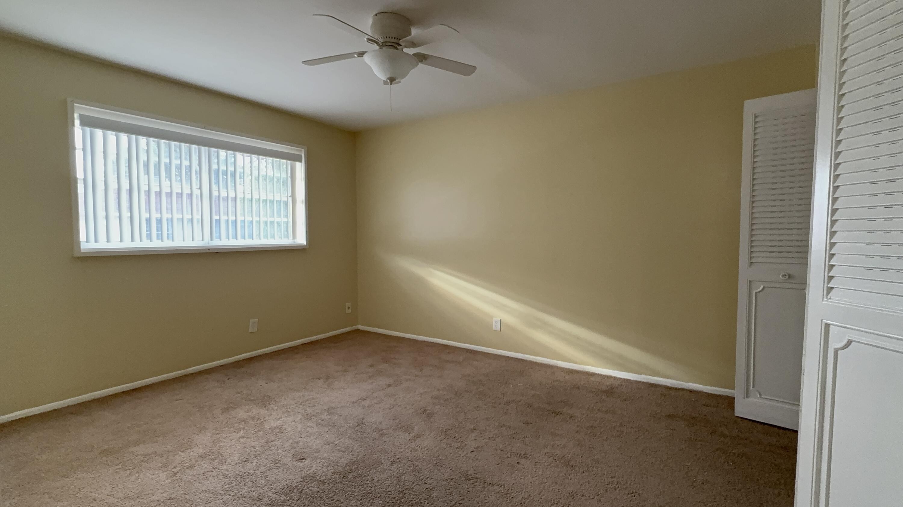 12009 Poinciana Boulevard, Unit 202 Royal Palm Beach, FL 33411 - Photo 19 of 24 a view of an empty room with a window