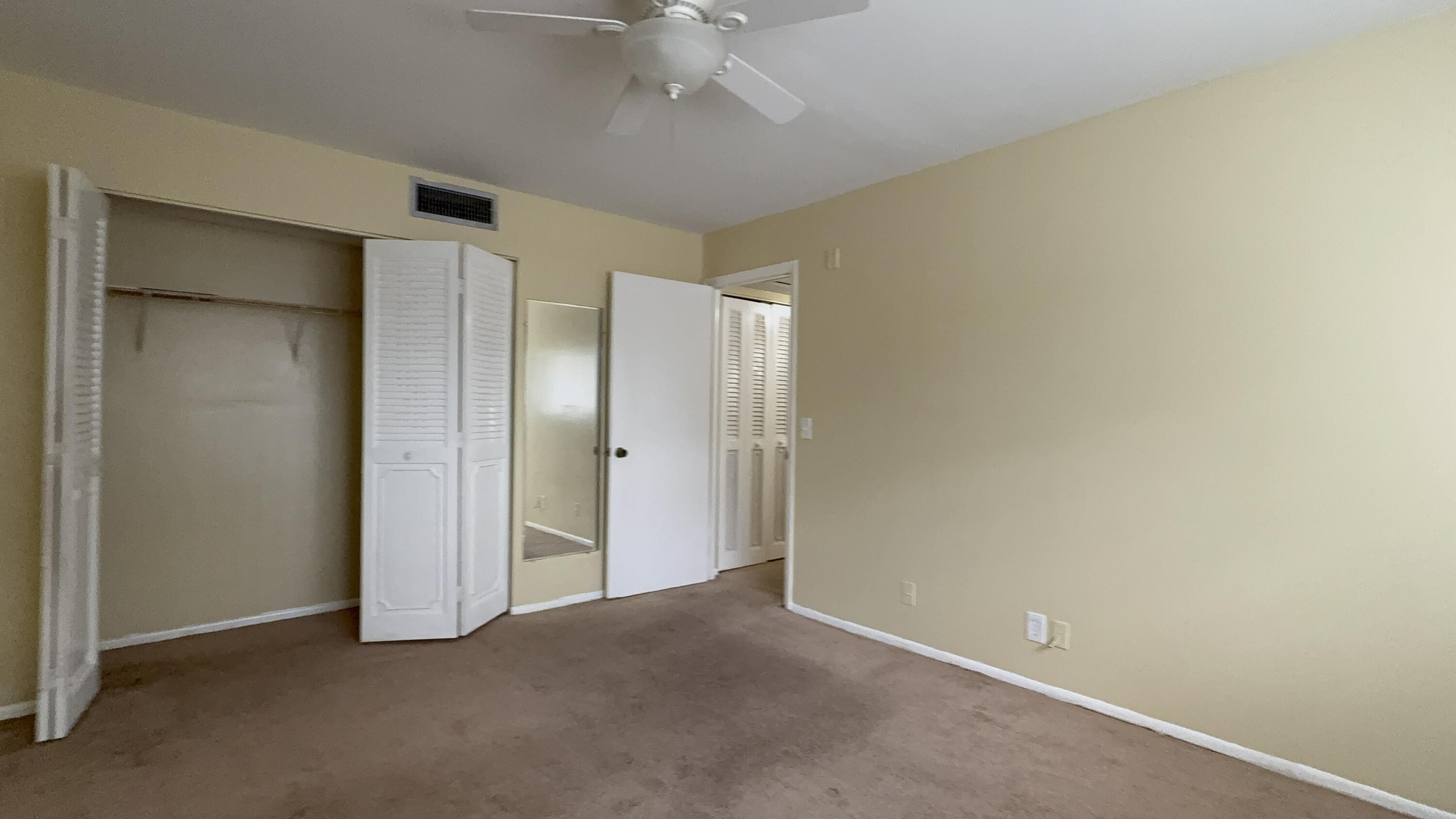 12009 Poinciana Boulevard, Unit 202 Royal Palm Beach, FL 33411 - Photo 21 of 24 an empty room with a bathroom