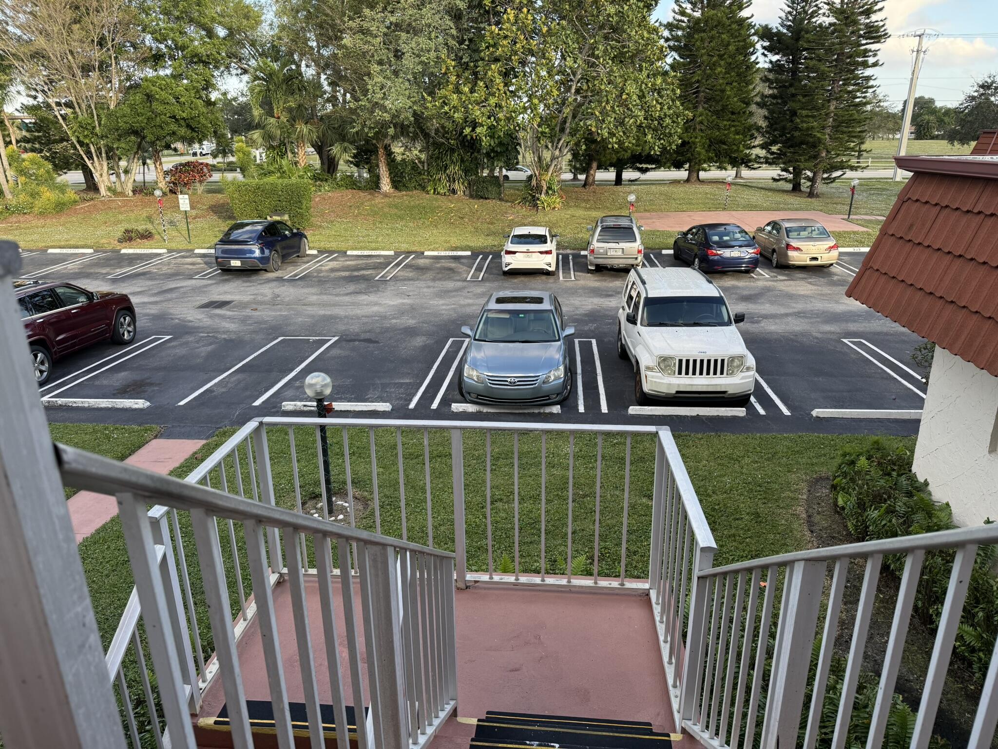 12009 Poinciana Boulevard, Unit 202 Royal Palm Beach, FL 33411 - Photo 22 of 24 a view of a swimming pool with a patio and a yard