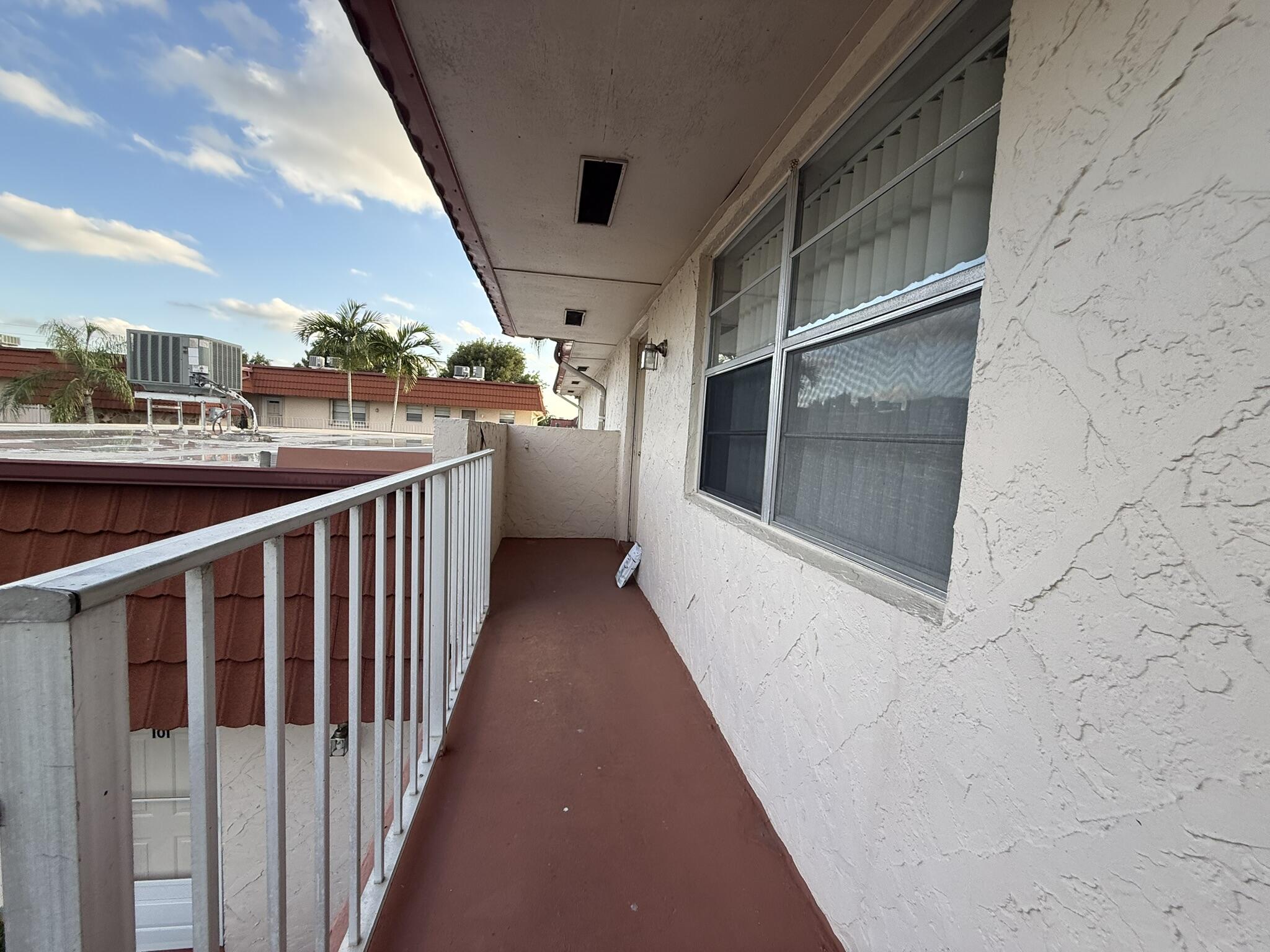 12009 Poinciana Boulevard, Unit 202 Royal Palm Beach, FL 33411 - Photo 23 of 24 a view of a balcony
