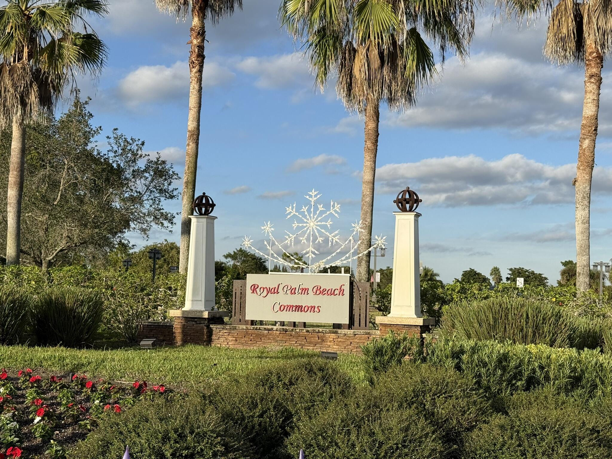12009 Poinciana Boulevard, Unit 202 Royal Palm Beach, FL 33411 - Photo 24 of 24 a sign on the side of the road