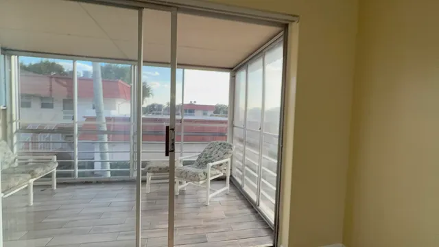 a view of a glass door and an empty room