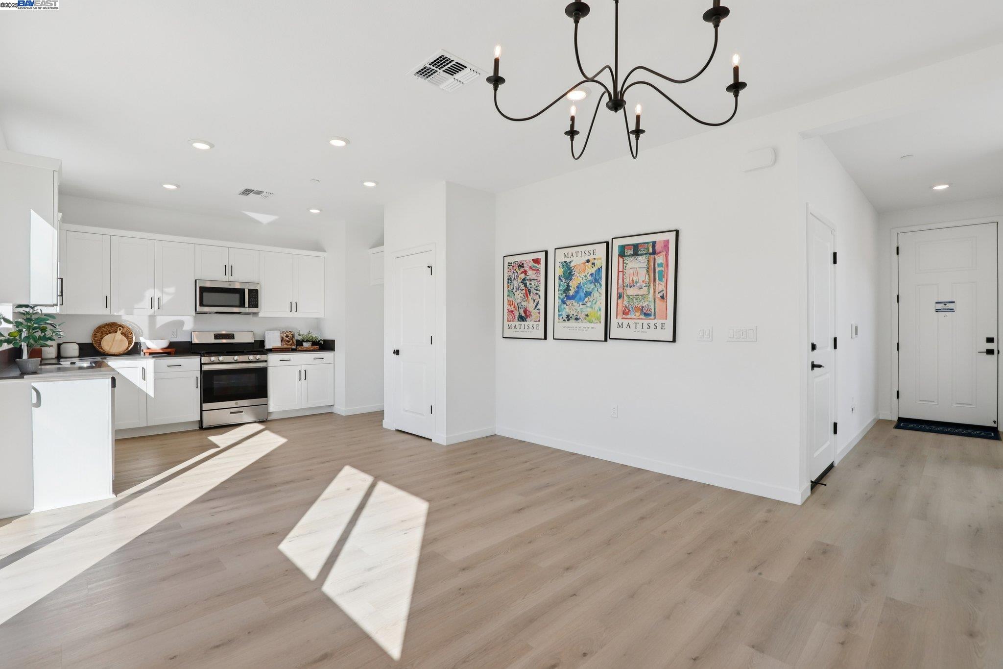 863 Pecan Tree Lane Galt, CA 95632 - Photo 4 of 30 a view of a kitchen with microwave and cabinets