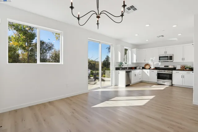 a view of a kitchen with microwave and cabinets