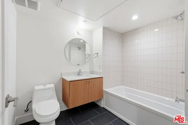 a bathroom with a toilet a sink and bathtub