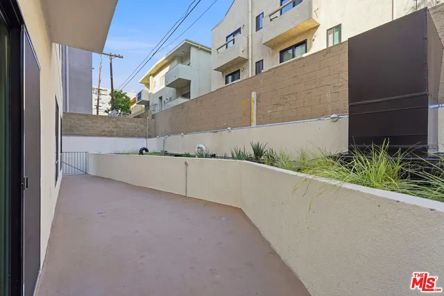 a view of a terrace with furniture and a table