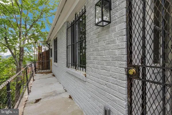 a view of a balcony with wooden floor