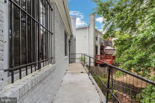 a balcony with trees in front of it