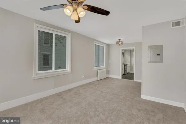 a view of an empty room with a window