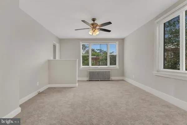a view of an empty room with a window