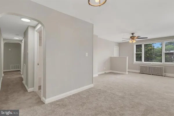 a view of an empty room with a window