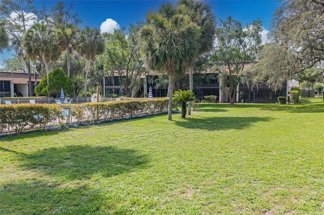 a backyard of a house with lots of green space
