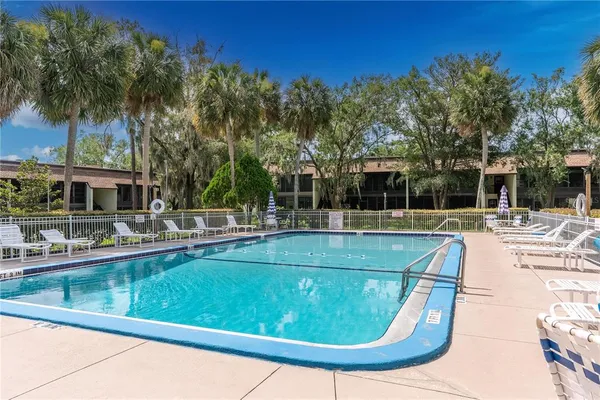 a view of a swimming pool with a patio