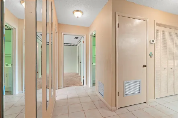 a kitchen with a stove a sink and a refrigerator